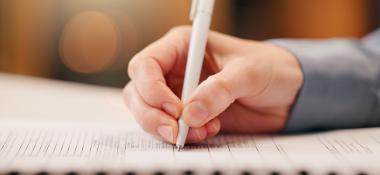 Closeup of a person filling out a form