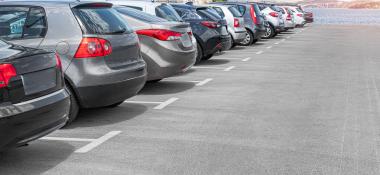 Cars parked in a parking lot near the water