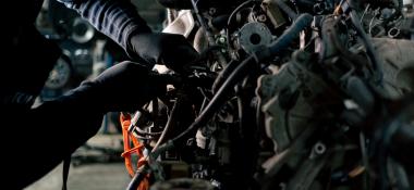 Person working on a car's engine